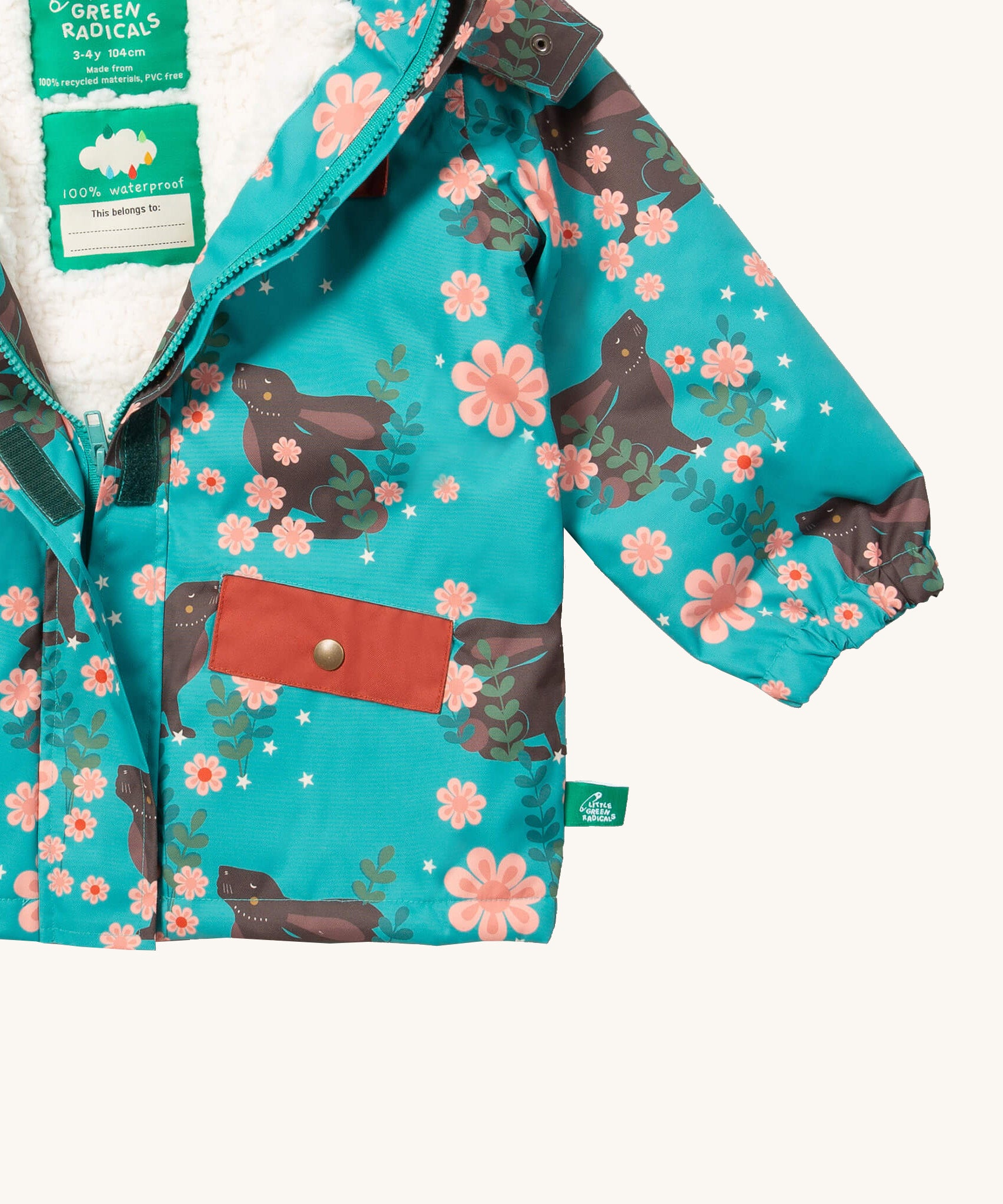 A close up of the Little Green Radicals waterproof coat in winter rabbits showing the sherpa fleece inner liner and full length zip detail on turquoise recycled polyester fabric