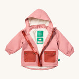 Little Green Radicals waterproof coat in coral available at Babipur. A thick pink with dark pink trim winter's coat made from recycled polyester. Features a sherpa fleece inner liner, elasticated arm cuffs for a snug fit and a full length zip  with a sherpa fleece inner liner