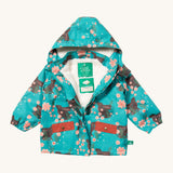 Little Green Radicals waterproof coat in winter rabbits available at Babipur. A thick turquoise with red trim winter's coat made from recycled polyester. Features a sherpa fleece inner liner, elasticated arm cuffs for a snug fit and a full length zip  with a sherpa fleece inner liner