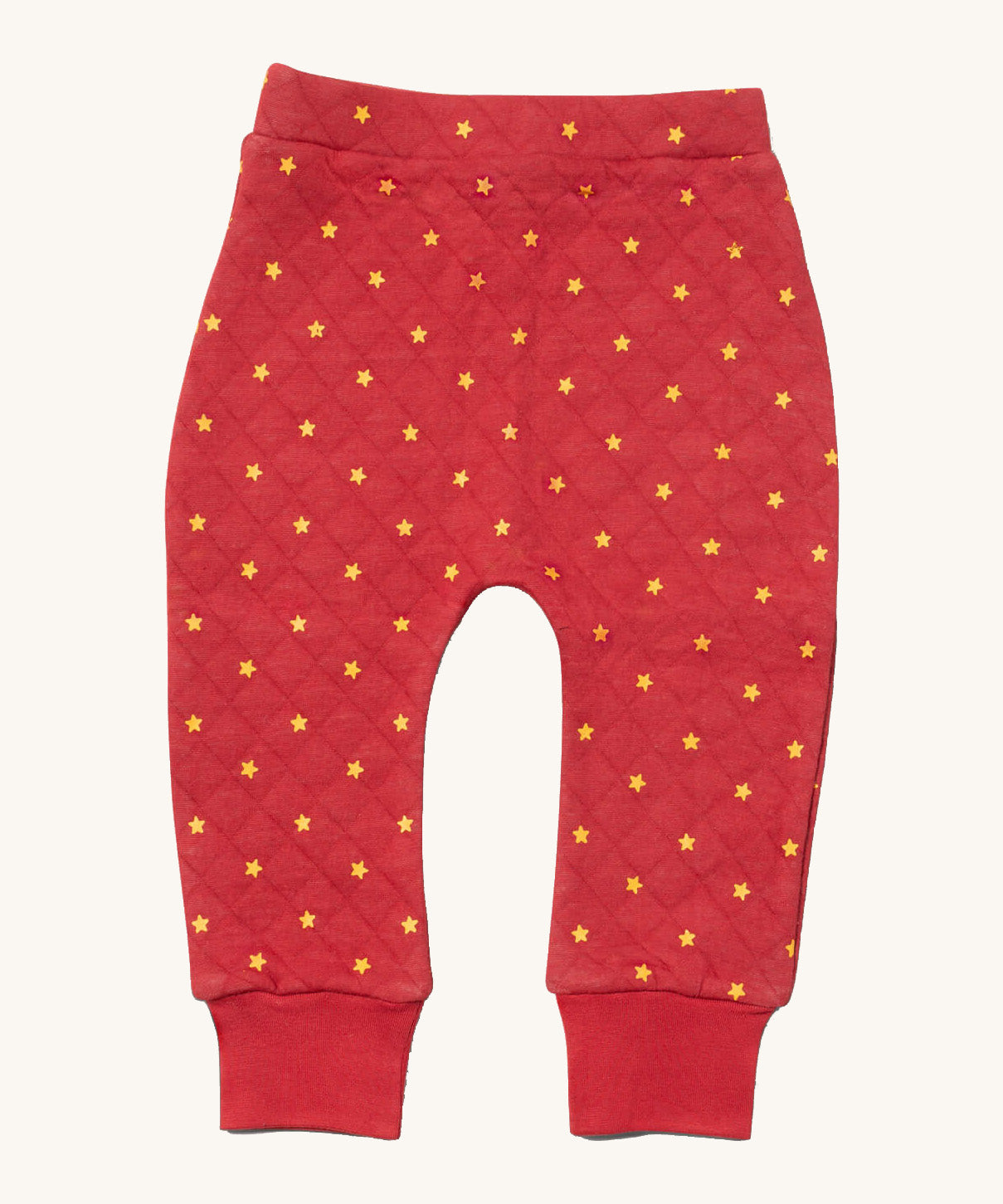 Little Green Radicals red star quilted joggers available at Babipur. A red GOTS organic cotton joggers with a quilted stitch with elasticated cuffs.