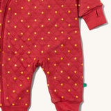 A close up of the Little Green Radicals hooded snug suit in flying birds showing the arm and leg cuff detail