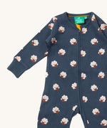 A close up of the Little Green Radicals navy sheep  baby grow, showing the zipper fastener detail on navy organic cotton fabric.