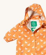 A close up of the Little Green Radicals gold ducks waterproof winter suit. Showing the sherpa fleece inner liner detail under the hood and 1/2 length zip detail and name patch stitched on the inside on yellow recycled polyester fabric.