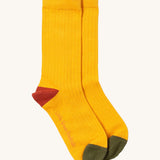 Little Green Radicals yellow block ankle socks from the winter rabbit set available at Babipur. A soft ribbed GOTS organic cotton sock with green and red trim.