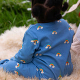 A baby wearing the Little Green Radicals Blue Rainbows Zip Organic Babygrow. The baby is facing away from the camera. Little green Radicals have a wide range of organic cotton, Fairtrade clothing and outerwear for babies and children available here at Babipur.