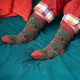 A close up of the winter rabbits design socks on a child's feet. Little Green Radicals Ankle Socks 3 Pack - Winter Rabbits. The organic cotton children's socks are a part of a wide range of organic cotton clothing for children available here at Babipur.