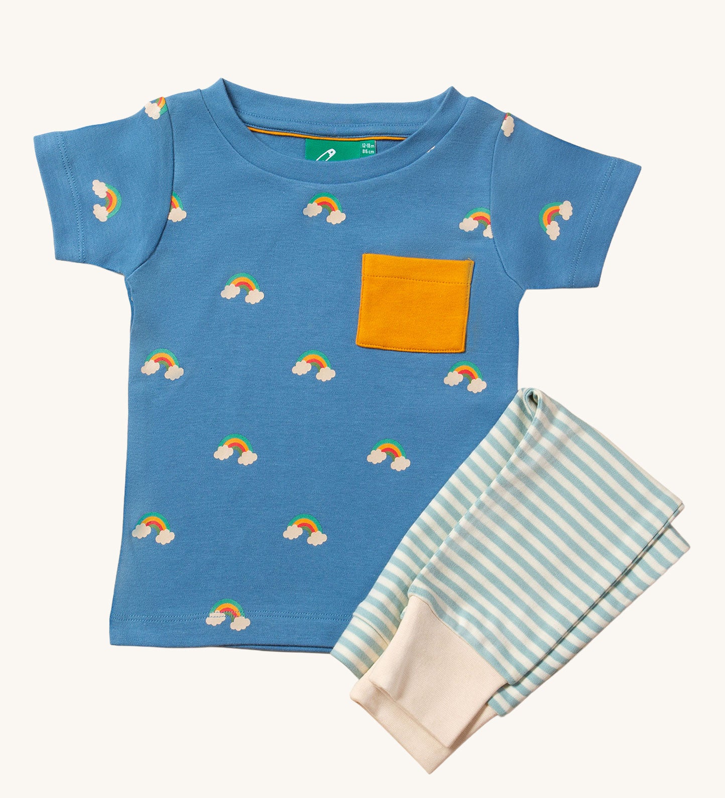 Little Green Radicals Kids' Organic T-shirt and Joggers Playset outfit in the  Blue Rainbows design. The joggers are light blue and white striped, the t-shirt has blue background with little rainbows dotted all over it.