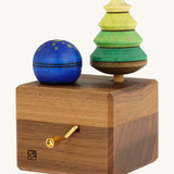 The Mader Luna music box hand made from walnut wood, with two spinning tops.