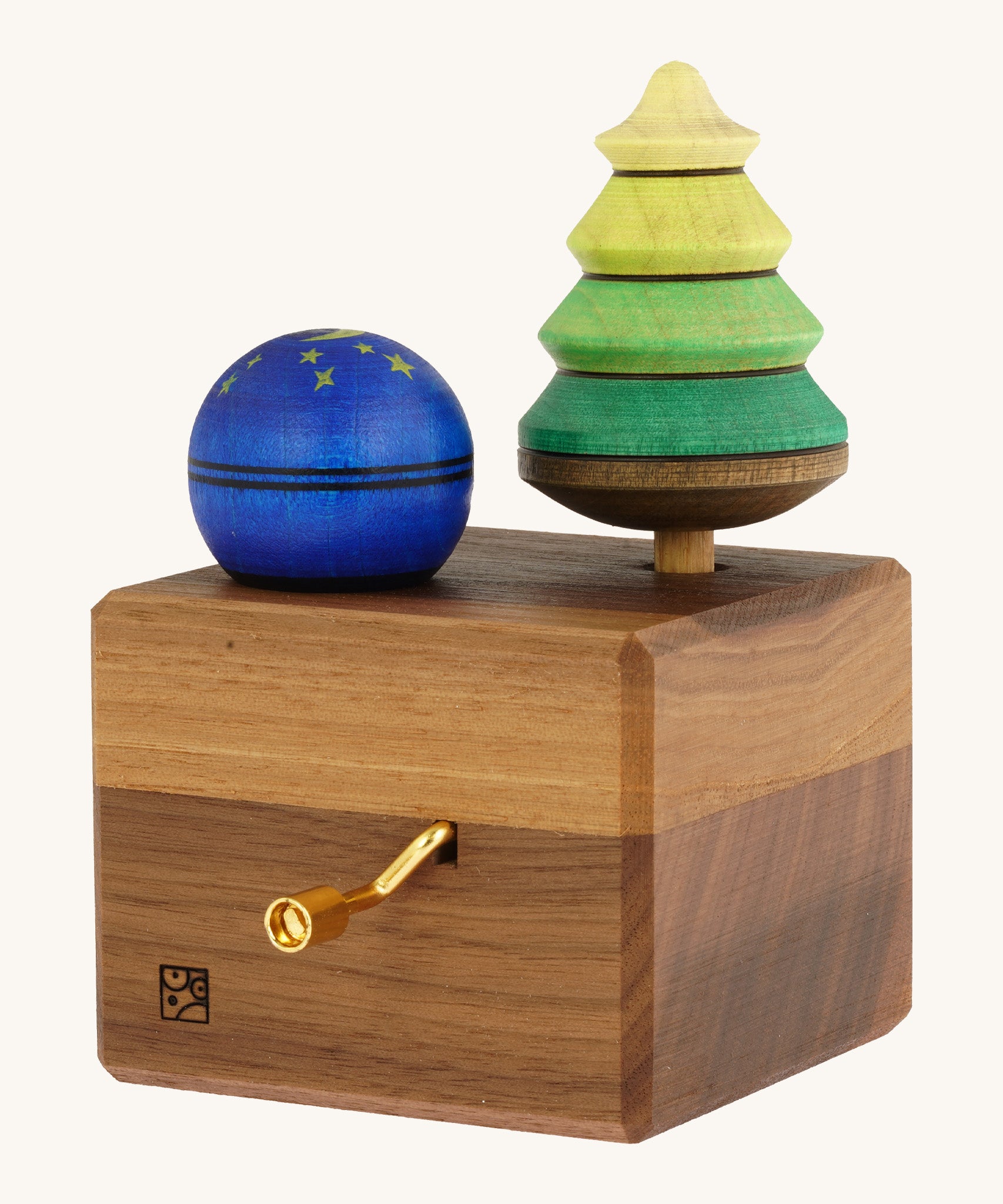 The Mader Luna music box hand made from walnut wood, with two spinning tops.