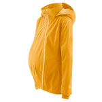 Mamalila Softshell Mustard Babywearing & Maternity Jacket worn with a pregnancy panel on a white background