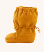Side image of the Mamalila toddler allrounder winter booties in the mustard yellow colour available at Babipur showing the elasticated ankle cuff detail
