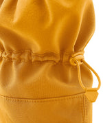 A close up of the Mamalila  baby allrounder winter booties in mustarf yellow available at Babipur showing the toggle detail