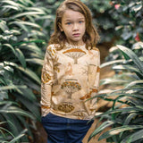 giraffes and tree names repeat print. Worn by child with long hair