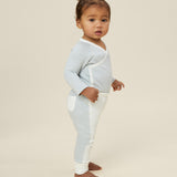 A toddler wearing the Mori organic cotton and bamboo kimono bodysuit in a blue stripe design.