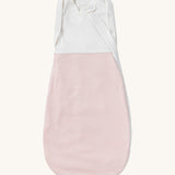 MORI baby swaddle bag. 100% organic bamboo and cotton swaddle in pink and white stripes. Features poppers by the arms and neck for easy fitting.
