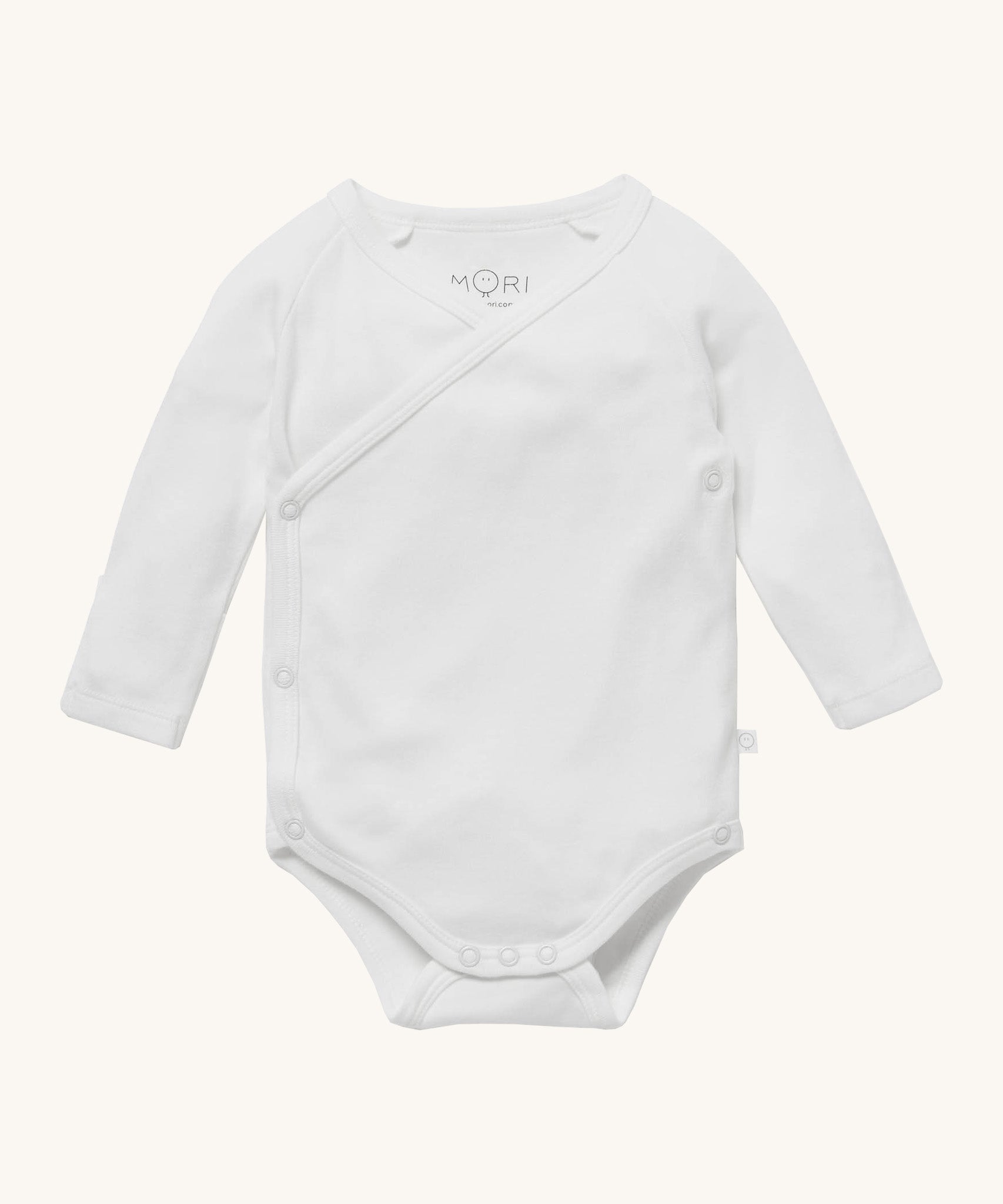 MORI baby kimono bodysuit. 100% organic cotton wrap-style front kimono in white. Features poppers at the crotch for easy fitting