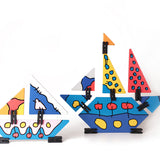 Naef Art Uris kit built up into two boats on a white background