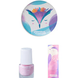 The contents of the Namaki Kids' Makeup Trio Giftset; a compact mirror with an owl design, a light pink non-toxic nail polish, and a natural, organic child-safe lip balm.