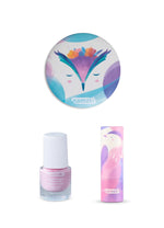 The contents of the Namaki Kids' Makeup Trio Giftset; a compact mirror with an owl design, a light pink non-toxic nail polish, and a natural, organic child-safe lip balm.