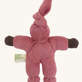 The back of the Nanchen Pimpel Waldorf Handcrafted Doll with a berry pink coloured outfit an matching knotted hat.