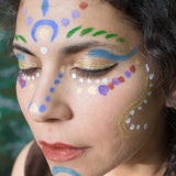blue and orange patterns on her face