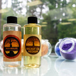 Close up on bottles of Natural Earth eco-solve paint thinner and walnut oil on a white table