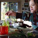 child using the Natural Earth Paint Egg Dye Kit
