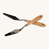 Natural Earth Paint palette knife, showing the metal head for mixing paint and a smooth wooden handle for comfortable handling