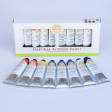 Natural Earth Paint acrylic classic studio paint set showing 8 aluminium tubes containing different coloured paints laid flat on a light surface next to the paint set packaging.