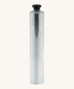 A blank flexible aluminium tube from Natural Earth Paint standing upright. Features a black screw cap to keep the contents inside the tube