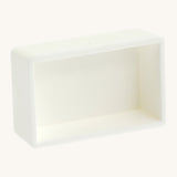 A blank white watercolour paint pan from Natural Earth Paint showing the space inside to hold a mix of homemade paint