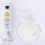 A top down view of the Natural earth paint in titanium white rutile next to the white paint pigment powder and 2 streaks showing the consistency.