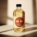 A 8oz jar of Natural Earth Paint walnut oil medium on a wooden surface - a binder to mix with the Earth & Mineral Pigments