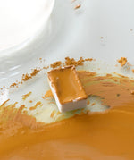 Natural Earth Paint watercolour pan filled with mustard yellow paint