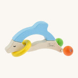 Nic Toys wooden dolphin rattle, features a yellow ring around the body and 2 grasper  balls representing the tail