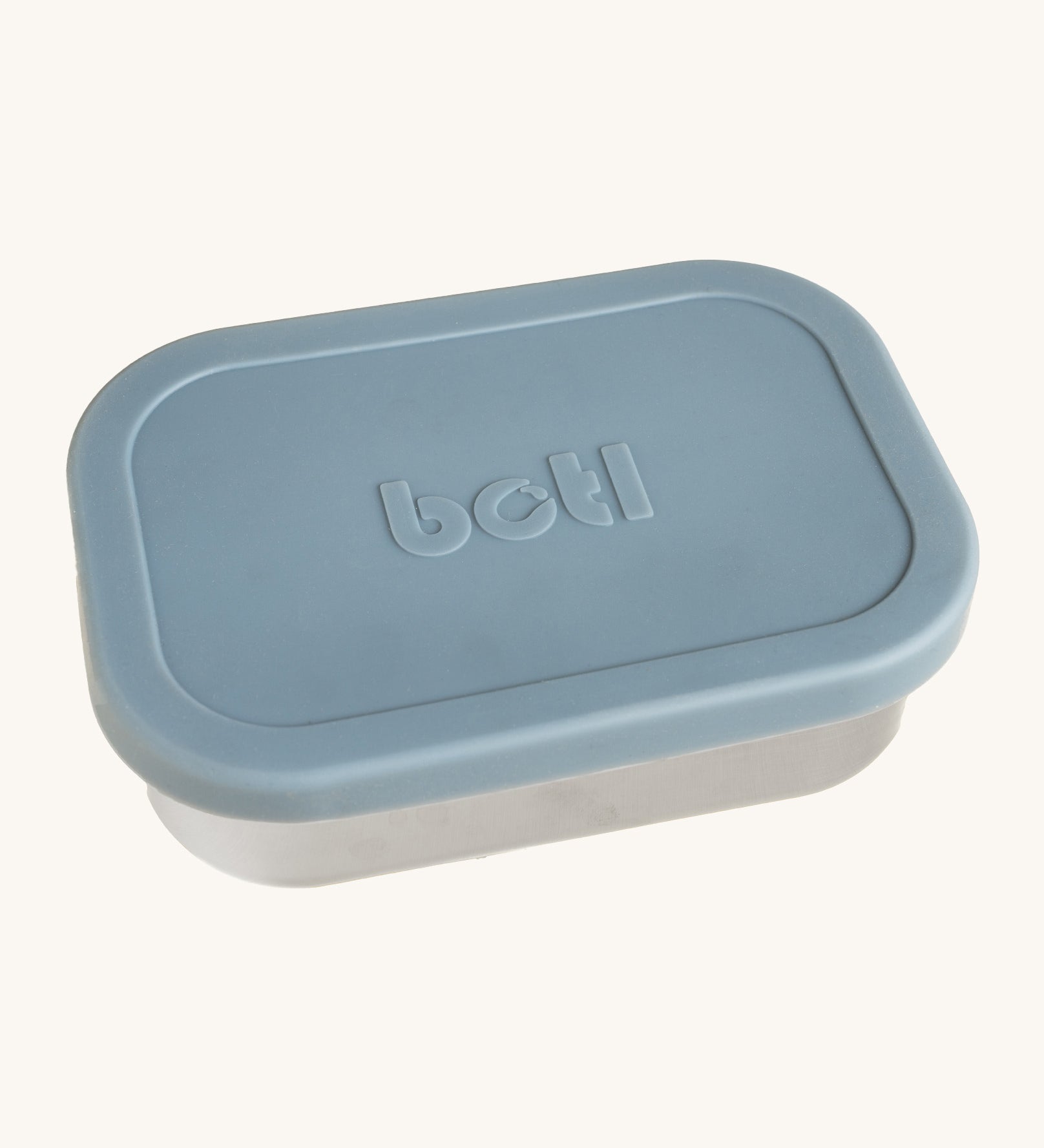 A One Green Bottle lunchbox in soldier colour. A stainless steel plastic free lunchbox available at Bapipur. Features a pale blue silicone lid.