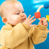 Side view of Oli & Carol X Bauhaus Movement Teething Ring pictured on a plain white background
