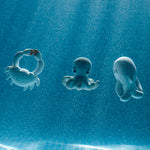 Three Oli and Carol bath toys; a crab
