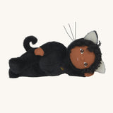 Olli Ella Carson Cat Dinky Dinkum Doll laying on it's side. This soft toy is a black cat with glow in the dark inner ears and a small embroidered rainbow detail on the chest. These soft toys are part of Olli Ella's Halloween collection available here at Babipur.