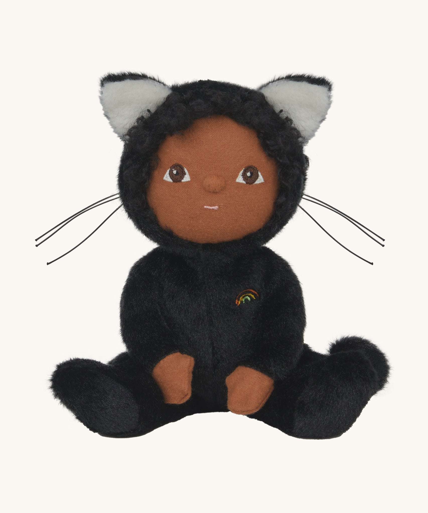 Olli Ella Carson Cat Dinky Dinkum Doll. This soft toy is a black cat with glow in the dark inner ears and a small embroidered rainbow detail on the chest. These soft toys are part of Olli Ella's Halloween collection available here at Babipur.