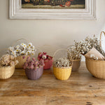 hanging from some white hooks on a wall