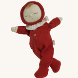 The Olli Ella Dozy Dinkum Doll - Toadstool Moppet, wearing a red mushroom onesie with a white ruffled collar.