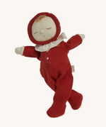 The Olli Ella Dozy Dinkum Doll - Toadstool Moppet, wearing a red mushroom onesie with a white ruffled collar.