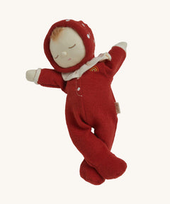 The Olli Ella Dozy Dinkum Doll - Toadstool Moppet, wearing a red mushroom onesie with a white ruffled collar.
