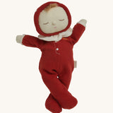 The Olli Ella Dozy Dinkum Doll - Toadstool Moppet, wearing a red mushroom onesie with a white ruffled collar.