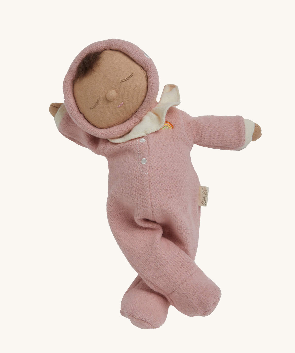 The Olli Ella Dozy Dinkum Doll - Toadstool Pip. It has a pink onesie with a and a ruffled collar.