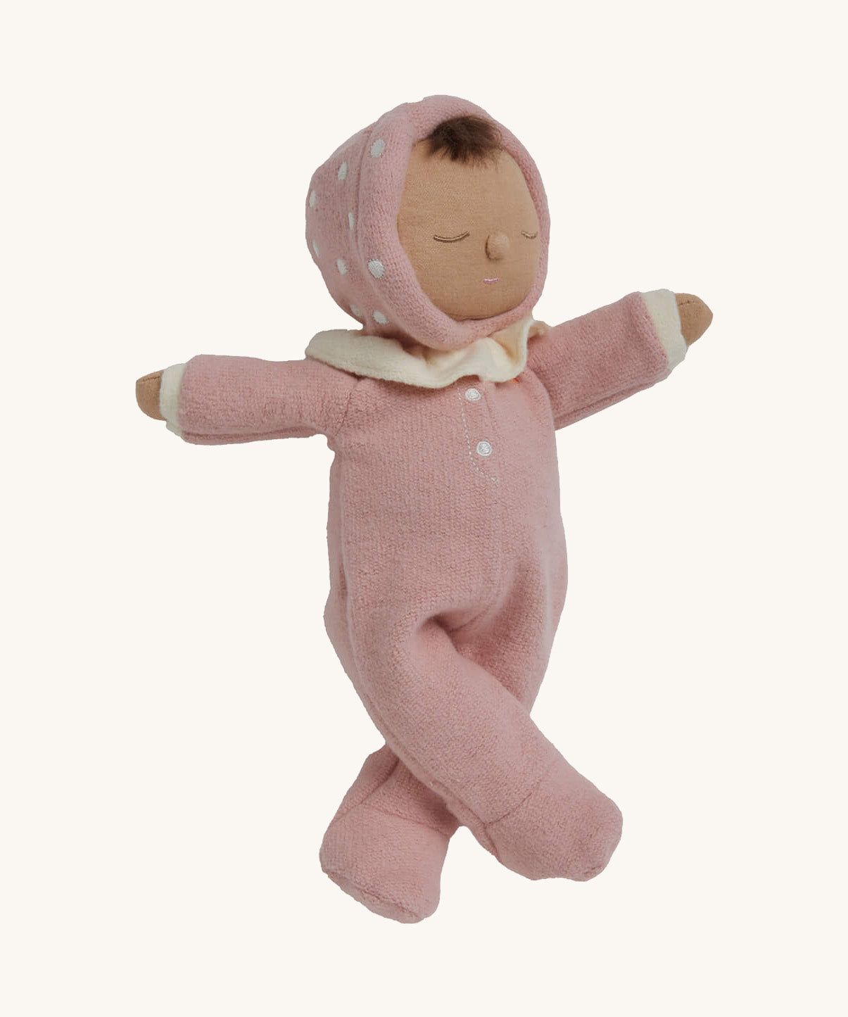 The Olli Ella Dozy Dinkum Doll - Toadstool Pip. It has a pink onesie with a and a ruffled collar.