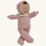 The Olli Ella Dozy Dinkum Doll - Toadstool Pip. It has a pink onesie with a and a ruffled collar.