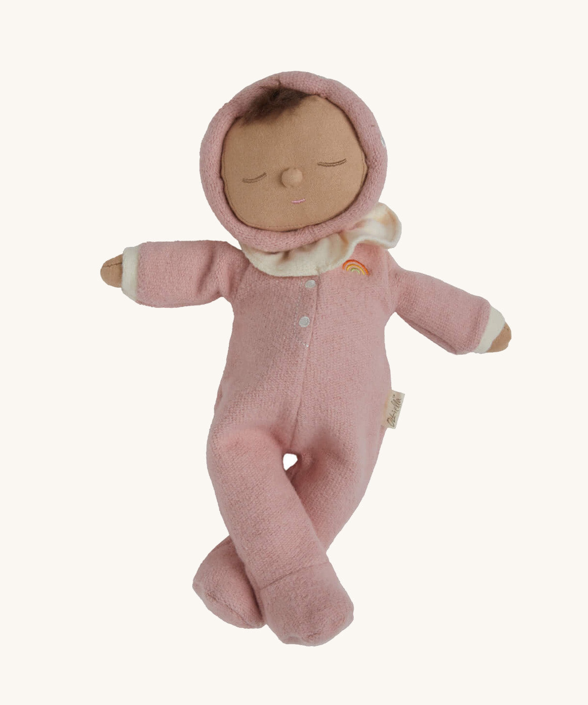 The Olli Ella Dozy Dinkum Doll - Toadstool Pip. It has a pink onesie with a and a ruffled collar.