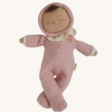 The Olli Ella Dozy Dinkum Doll - Toadstool Pip. It has a pink onesie with a and a ruffled collar.
